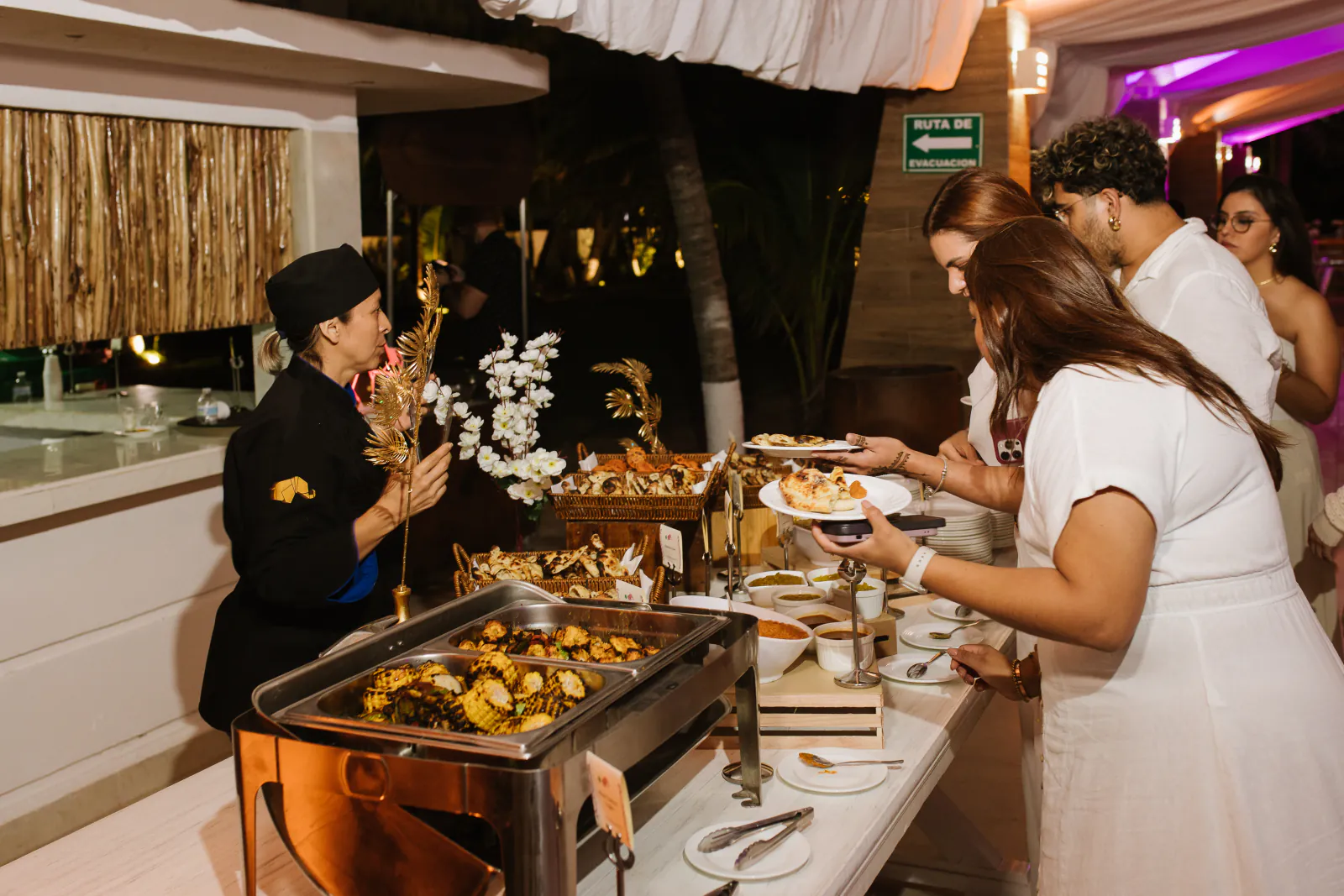 Guests enjoying a Tandoori buffet during a destination celebration